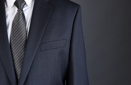 Closeup of a businessman Charcoal Gray Suit with white shirt and tie.