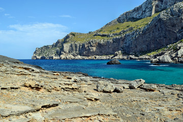 Sea bay with turquoise water, beach and mountains, Cala Figuera on Cap Formentor