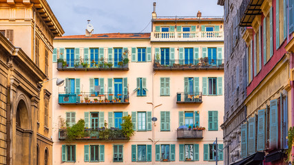 Fototapeta premium Nice, France, colorful facade, with typical windows and shutters 