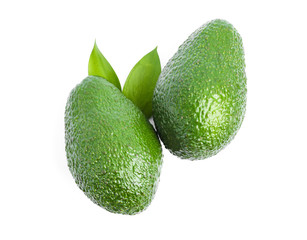 Ripe avocados with leaves isolated on white background. Healthy food