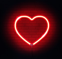 Red neon heart. Bright night neon sign on brick wall background with backlight. Retro red neon heart sign element. Romantic design for Happy Valentines Day. Vector illustration.