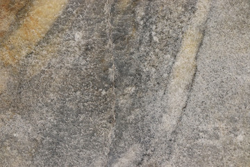 Natural marble background, natural natural texture of an ancient stone. It is used for finishing buildings and embankments, a fine background for a desktop and for photodesign