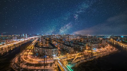 The starry sky above the night city. time lapse - Powered by Adobe