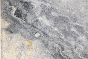 Natural marble background, natural natural texture of an ancient stone. It is used for finishing buildings and embankments, a fine background for a desktop and for photodesign