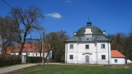 Small baroque castle with blue sky in South Bohemia
