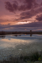 Landscape with reflections at sunset over the salt-mines in Pomorie, Bulgaria.