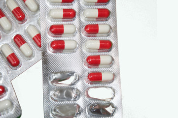 White and red pills isolated