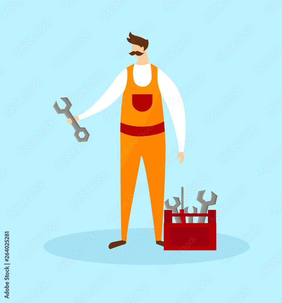 Wall mural mechanic in orange overalls holding wrench in hand