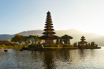 Peaceful atmosphere in early morning during sunrise over Pura Ulun Danu temple the Iconic of Bali, lake Bratan, Bali, Indonesia.