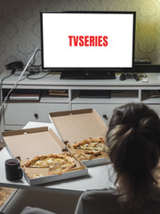 Pizza in delivey box with TV series in living room