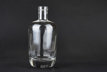 Empty spirit bottle on a black background