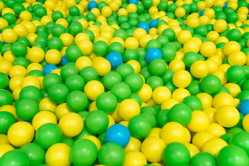 Green, yellow and blue balls in the playground