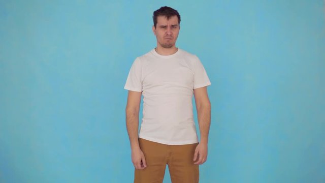 man sniffing armpit odor underarms