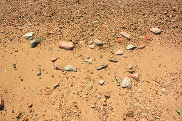 sand and stone background yellow color surface from above