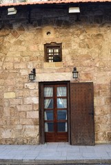 wooden door on the facade of and ancient house