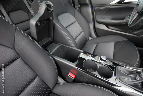 Open storage box between front car seats