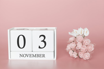 November 03rd. Day 3 of month. Calendar cube on modern pink background, concept of bussines and an importent event.