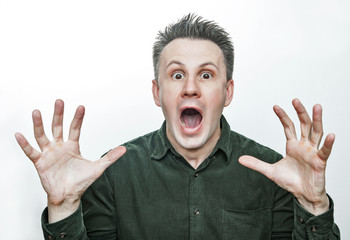 Man with shocked, amazed expression isolated on white background.