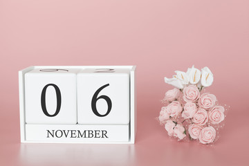 November 06th. Day 6 of month. Calendar cube on modern pink background, concept of bussines and an importent event.