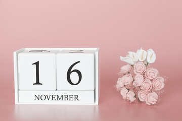 November 16th. Day 16 of month. Calendar cube on modern pink background, concept of bussines and an importent event.
