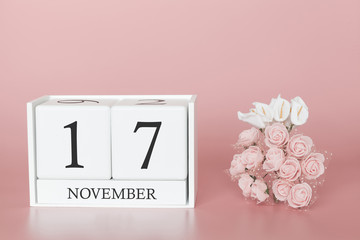 November 17th. Day 17 of month. Calendar cube on modern pink background, concept of bussines and an...