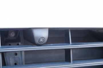 Closeup. Front view camera in the front bumper of the car. Circular 360 degrees surround view system.  Parking and offroad assist options of premium SUV