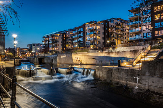 Long exposure shot of Akerselva river at Nydalen area during blue hour in Oslo, Norway