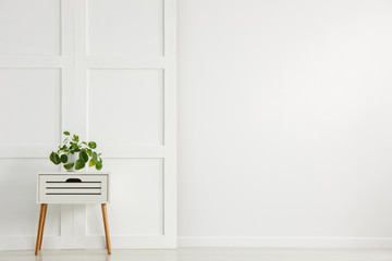 White small table with wooden legs on white background