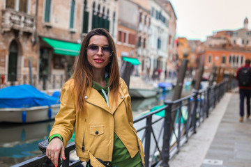 girl on Venice stress with Canal and city view 