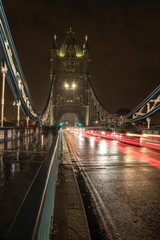 Traffic over the Tower Bridge at night.