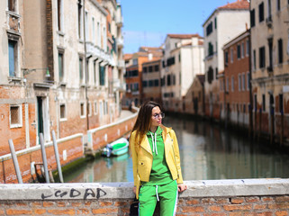 girl on Venice street with canal background. and streets 