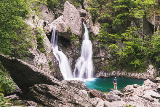 Man looking at waterfall Bash Bish Falls in MA