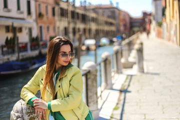 Obraz premium young woman on Venice canal background 