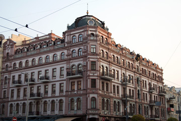 Fototapeta na wymiar Corner building facade in downtown district of Kyiv city on a spring day