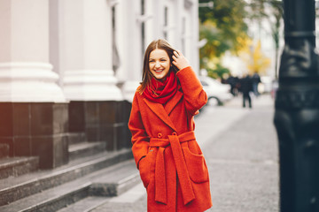 beautiful and stylish girl walking around the summer city