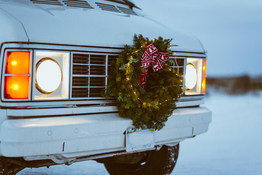 Front of vintage white van with christmas wreath