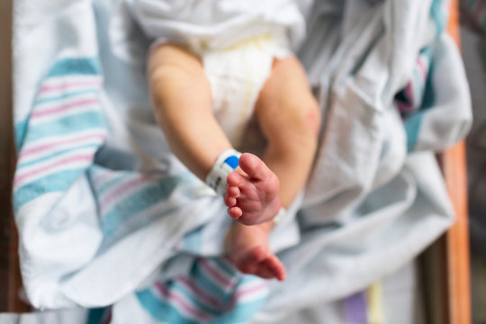 Overhead Newborn Feet in Hospital Bassinet, Stretching Legs