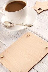 Cup of coffee and wooden board