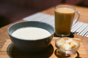 cheese soup in a coffee shop with coffee on the table.