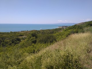 View of the sea from a green grassy hill in Bulgaria.