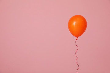 Bright balloon on color background, space for text. Celebration time © New Africa