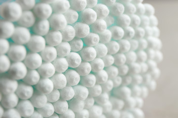 Many cotton swabs on grey background, closeup