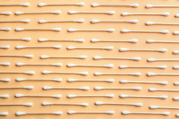 Flat lay composition with cotton swabs on color background