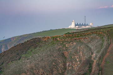 Fototapeta na wymiar white lighthouse on the coast of england