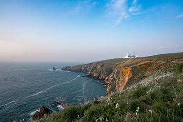 white lighthouse on the coast of england