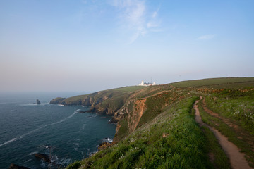 white lighthouse on the coast of england