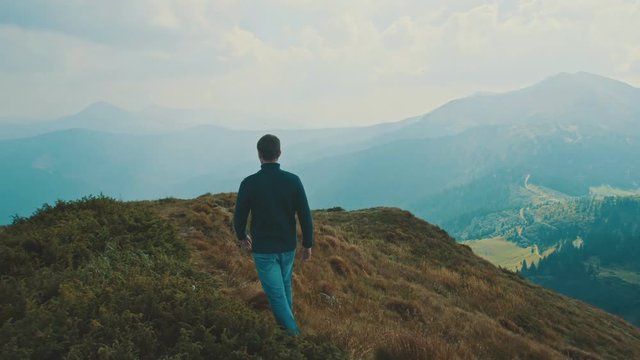 The man walking on a beautiful mountain