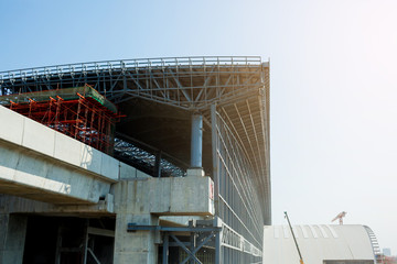 Under construction of metal steel framework outdoors buildings with blue sky background, metal steel framework of bridge construction, the concept of under construction.