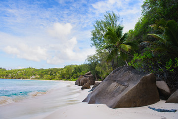 Seychelles sand beach view with big stones