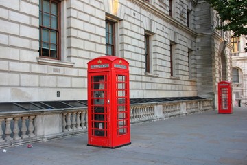 Fototapeta premium Classic british red phone booth on old street of London, UK